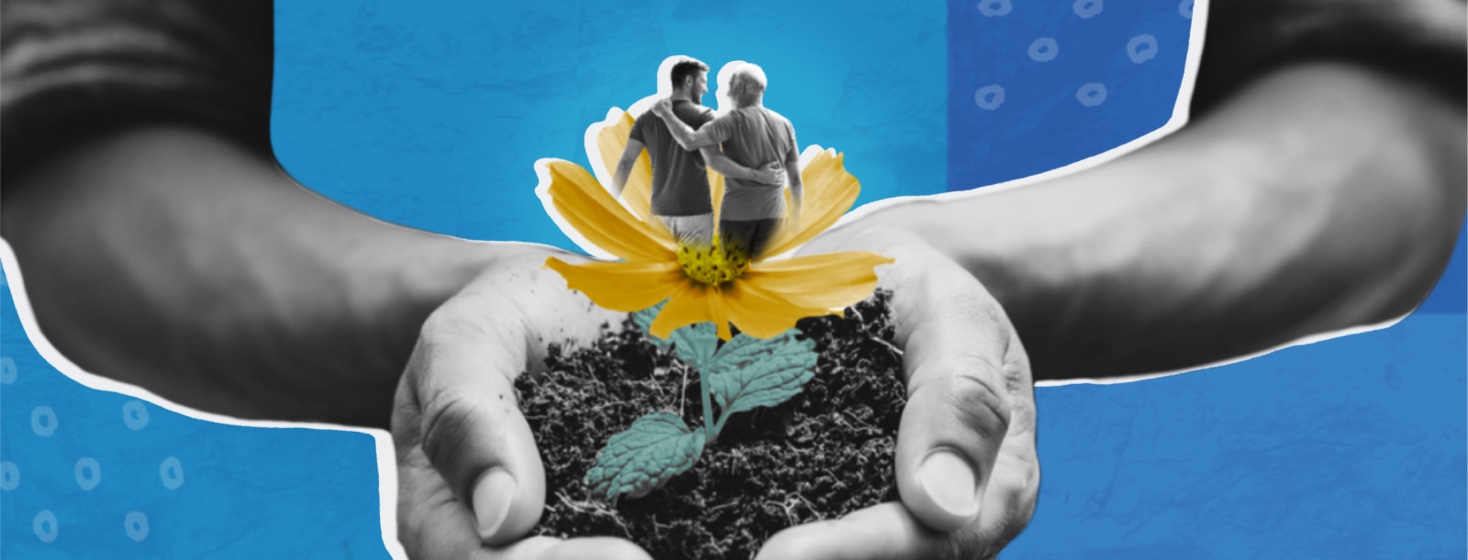 Hands holding soil and a growing flower blooming to show two men with their arms around each other