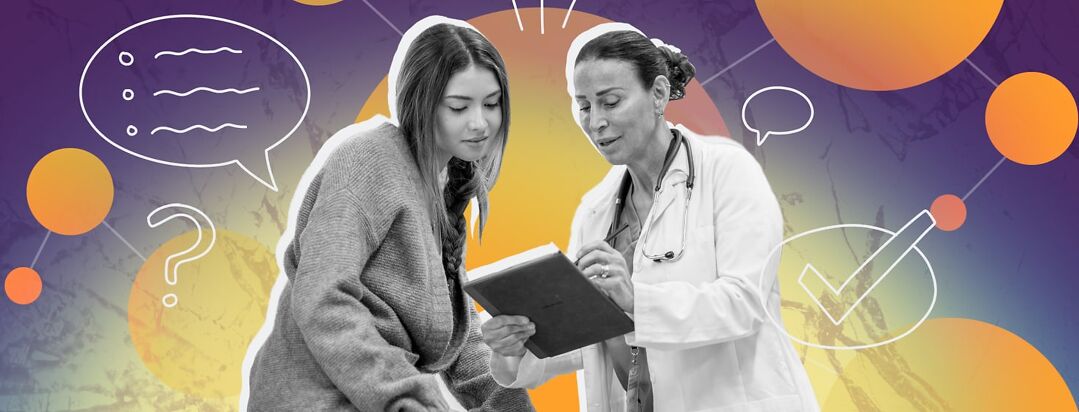 A female patient talks to a female doctor as they look at a clipboard together.